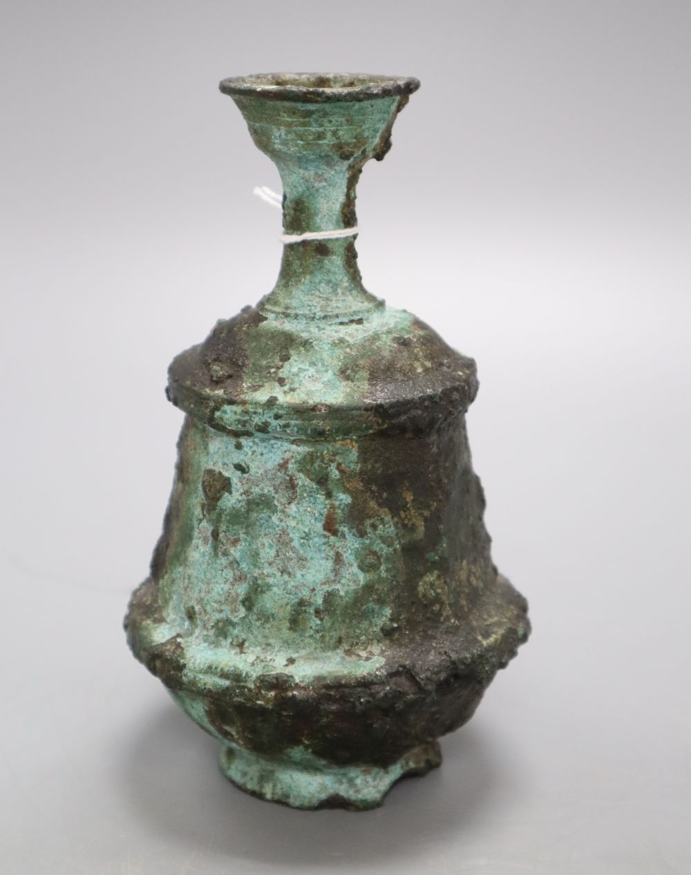 A Roman style oil bottle, height 16cm